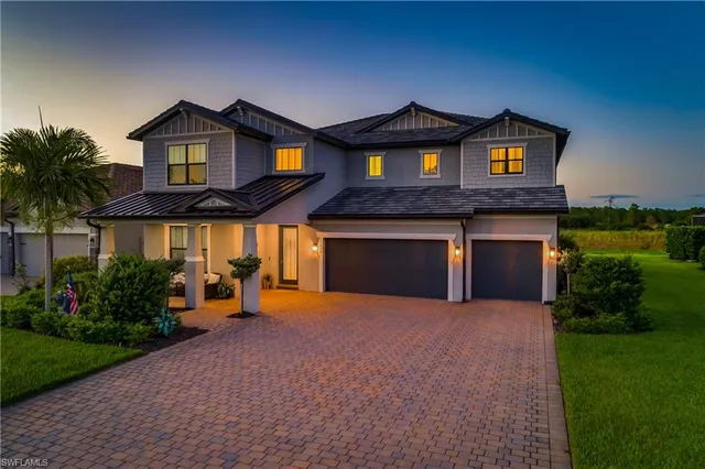a front view of house with yard and swimming pool