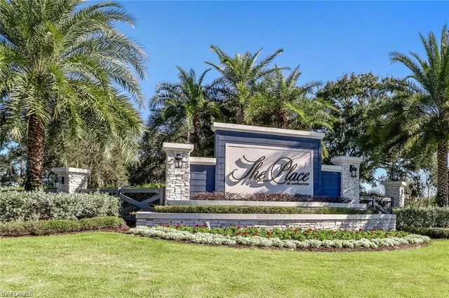 a view of a backyard with a table and chairs