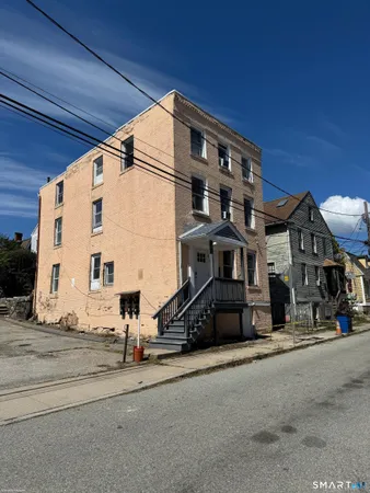 a view of a building with car parked