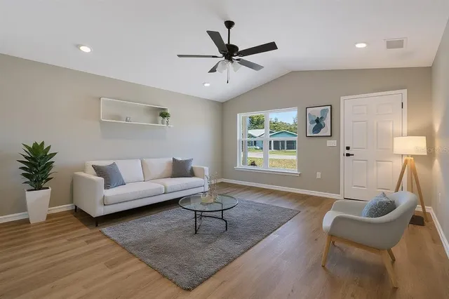 a living room with furniture and a window