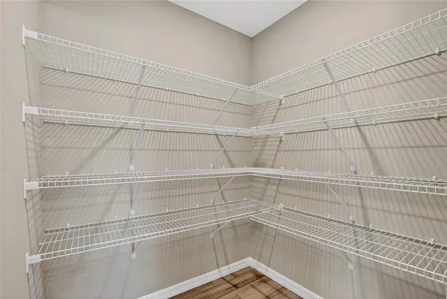 a view of a room with racks on the wall