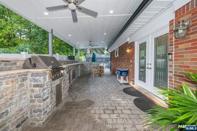 a view of a patio with table and chairs potted plants with wooden floor
