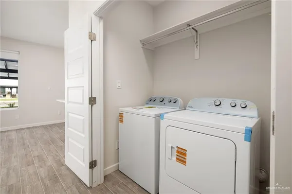 an empty room with cabinet and a ceiling fan
