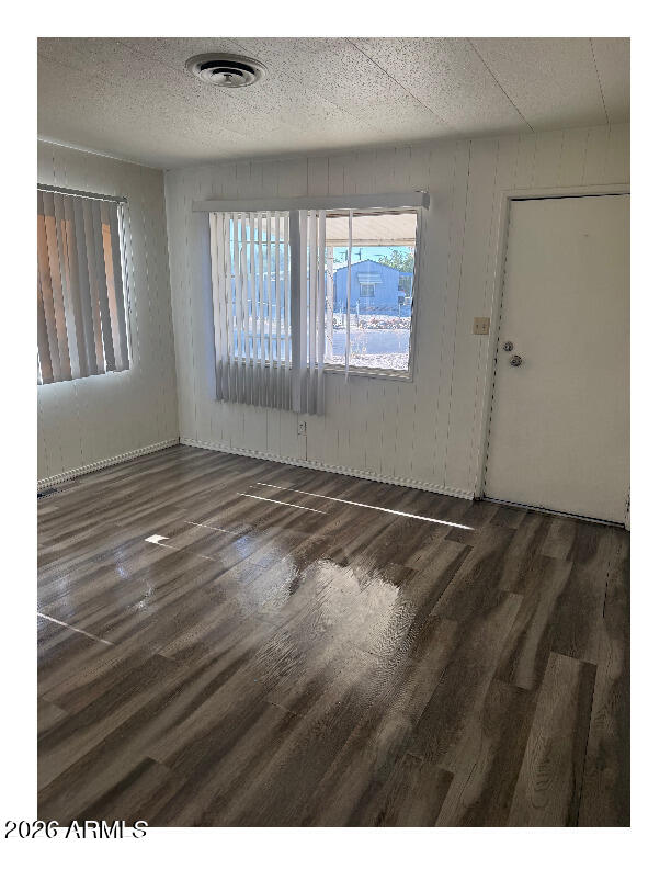 19222 North Pierson Road Peoria, AZ 85373 - Photo 7 of 7 a view of an empty room with wooden floor and a window