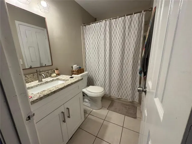 a view of a balcony with furniture