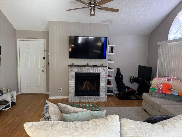 a living room with furniture and a fireplace