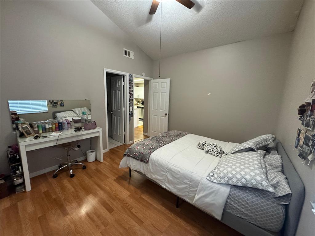 655 Magic Court, Unit 188 Altamonte Springs, FL 32714 - Photo 10 of 33 a bedroom with a bed and a desk