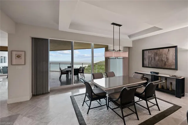 a view of a dining room with furniture window and outside view