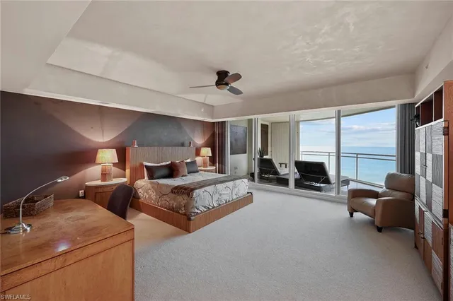 a bed room with two beds and a large window