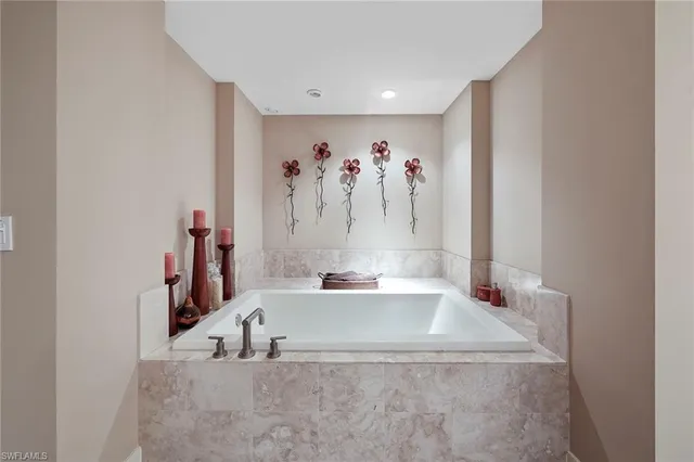 a bathroom with bathtub and a shower