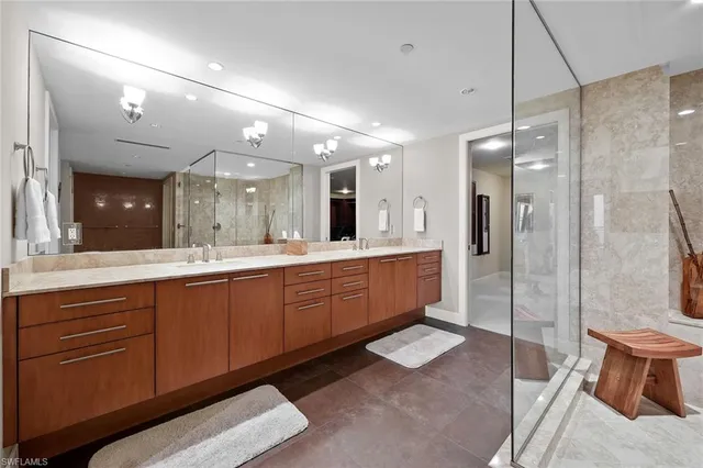 a bathroom with a sink mirror and toilet