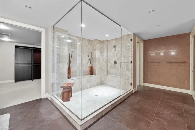 a bathroom with a tub and a shower
