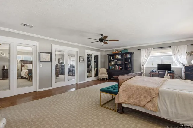 a bedroom with furniture and a dresser