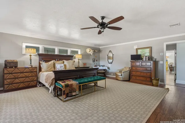 a bathroom with a sink mirror and toilet