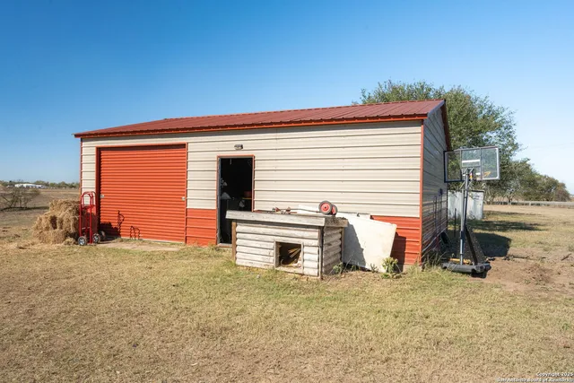 a view of a lake with beach and city