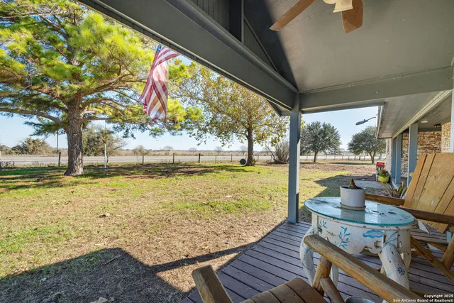 a view of swimming pool with outdoor seating