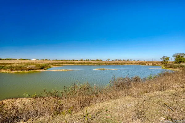 a view of a lake with a car parked