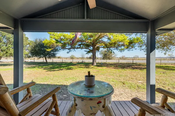 a view of a living room and floor to ceiling window or lake