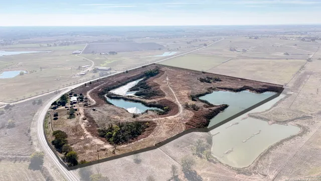 a view of a lake with beach and ocean view