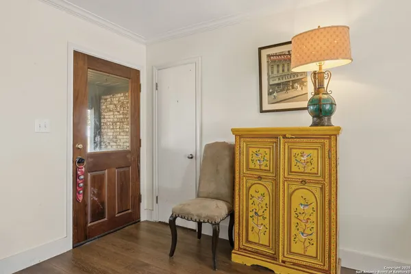 a view of front door with wooden door