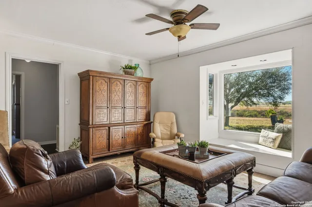 a living room with furniture and a window