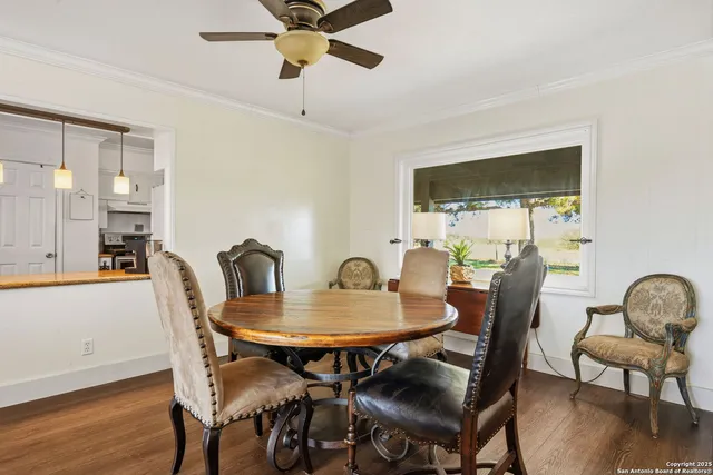 a view of a dining room with furniture window and wooden floor