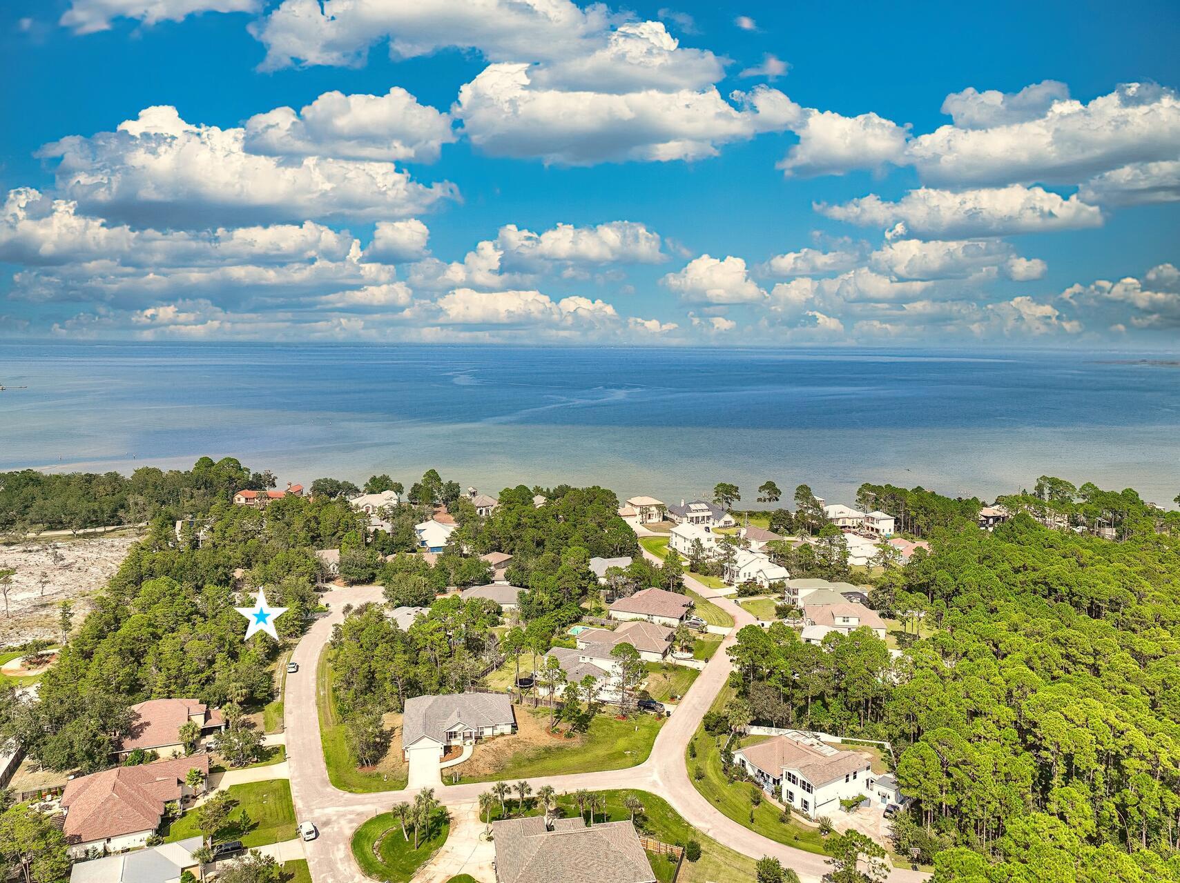 Lot 38 Wind Spray Court Santa Rosa Beach, FL 32459 - Photo 15 of 16 a view of a bunch of trees houses and a lake