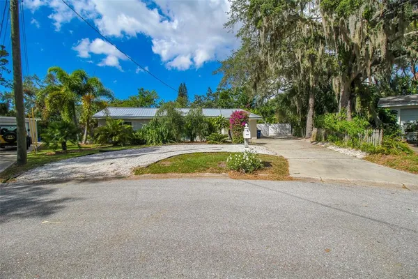 a view of a house with swimming pool and sitting area