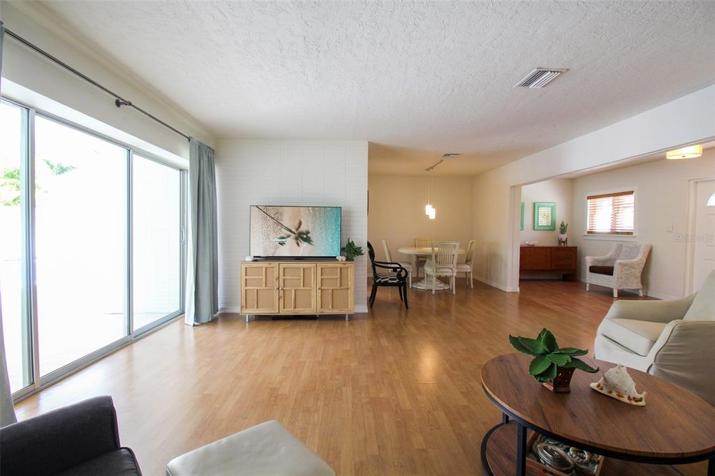 3223 Rowena Street Sarasota, FL 34231 - Photo 11 of 51 a living room with furniture and a large window