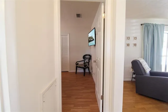 a view of a livingroom with couch and a window