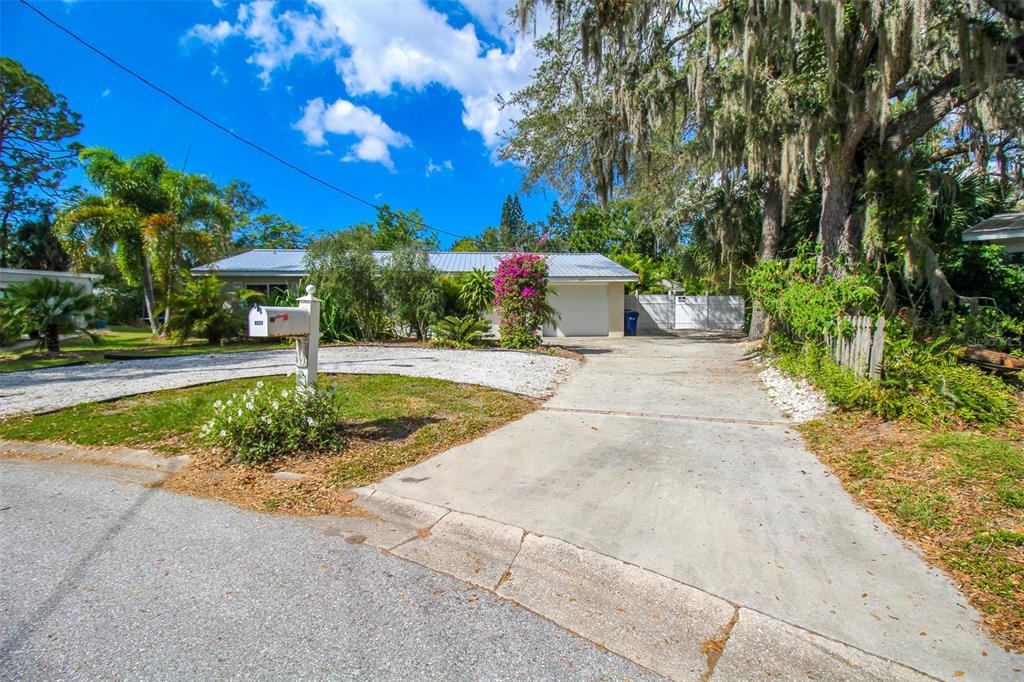 3223 Rowena Street Sarasota, FL 34231 - Photo 3 of 51 a view of a backyard with swimming pool