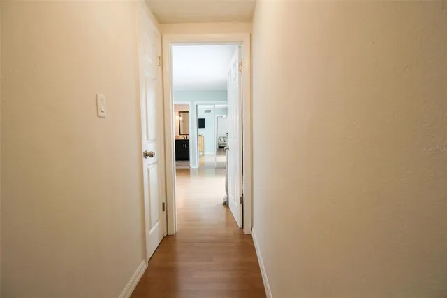 a view of a bathroom from a hallway