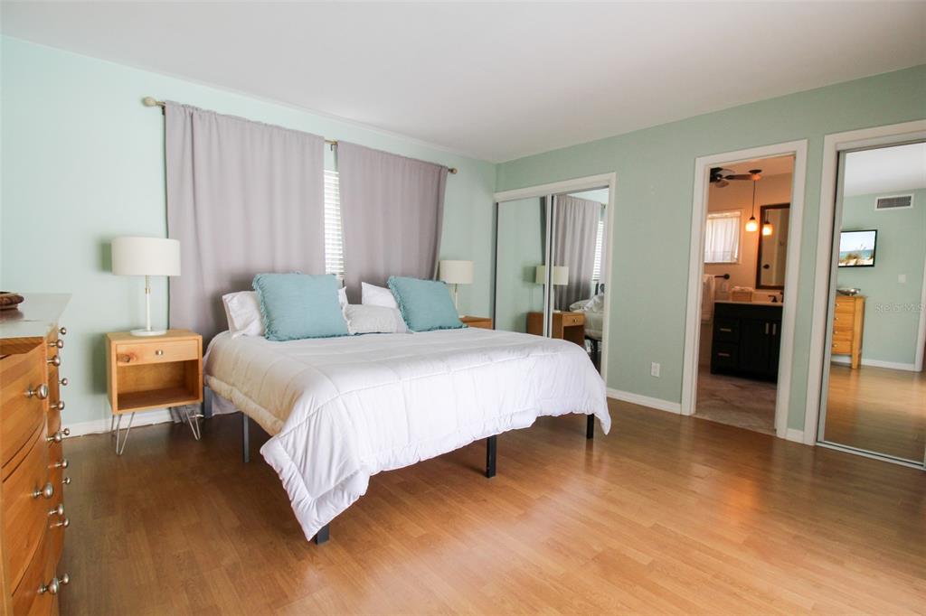 3223 Rowena Street Sarasota, FL 34231 - Photo 33 of 51 a bedroom with a bed and a table