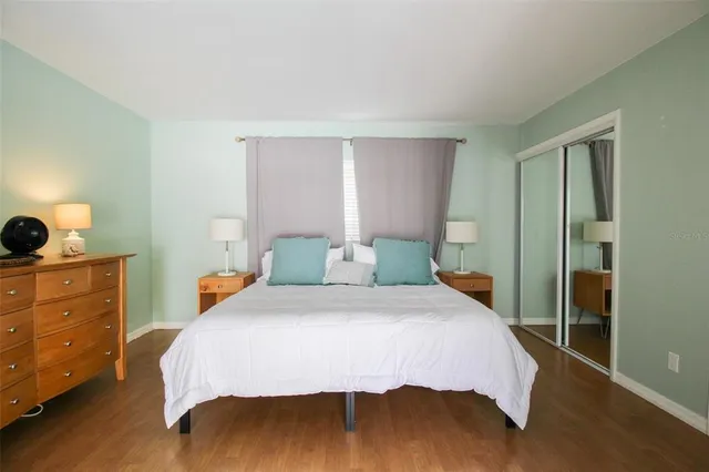 a bedroom with a bed and a dresser