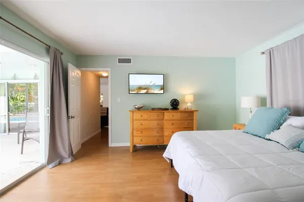 a bedroom with a bed and a view of bathroom