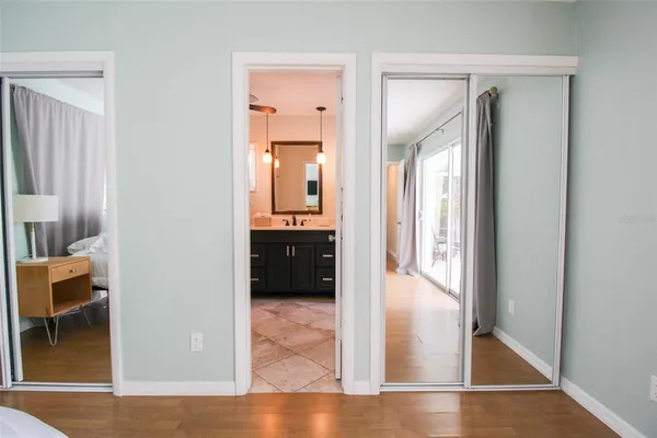 a bathroom with a sink vanity mirror and toilet