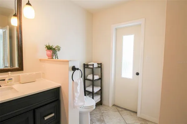 a bathroom with a sink shower and a mirror