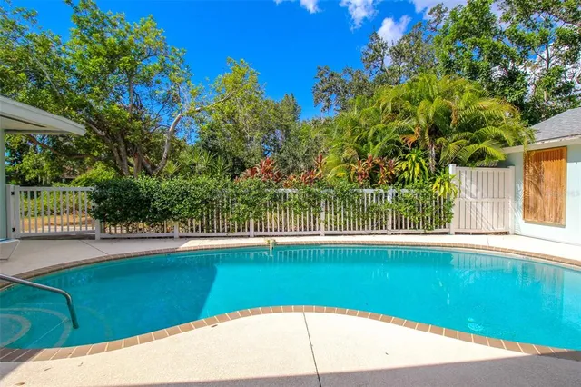 a dining room with a table and chairs