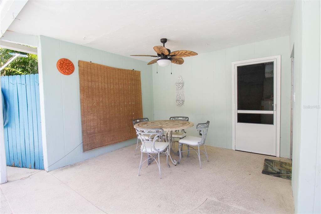 3223 Rowena Street Sarasota, FL 34231 - Photo 43 of 51 a dining room with a table and chairs