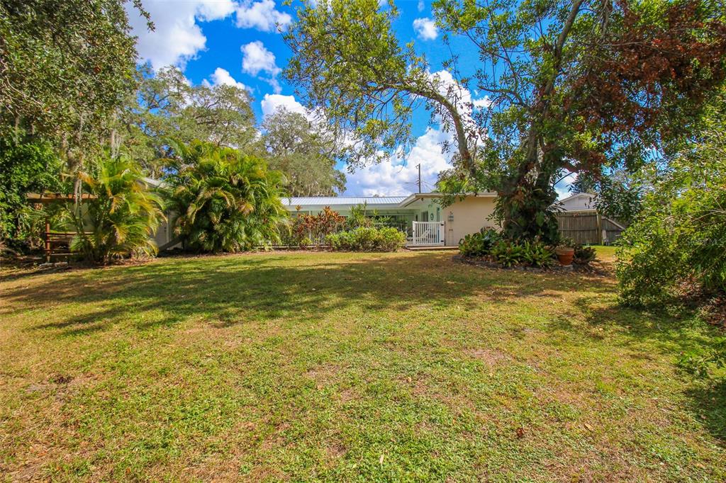 3223 Rowena Street Sarasota, FL 34231 - Photo 49 of 51 a view of a yard with yellow house