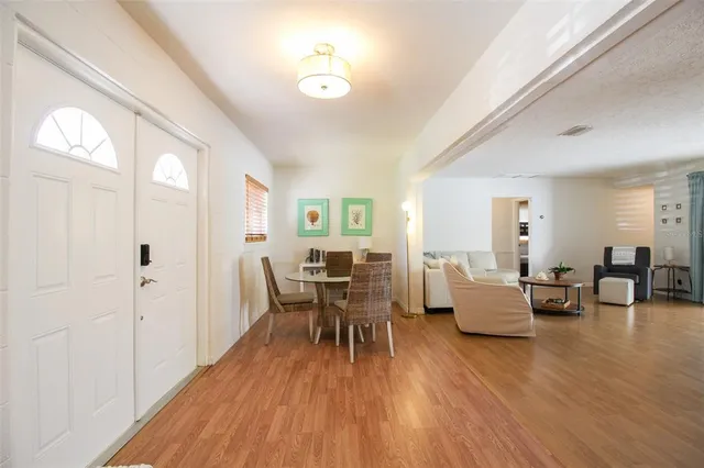 a living room with fireplace furniture and a wooden floor