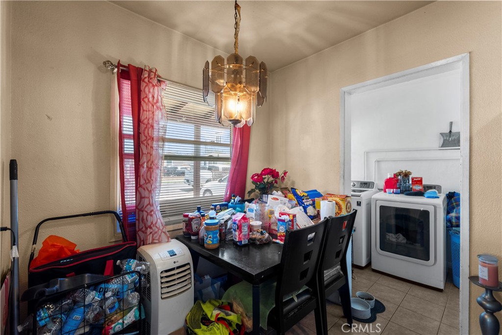908 West 132nd Street Compton, CA 90222 - Photo 12 of 36 a view of a dining room with furniture and chandelier