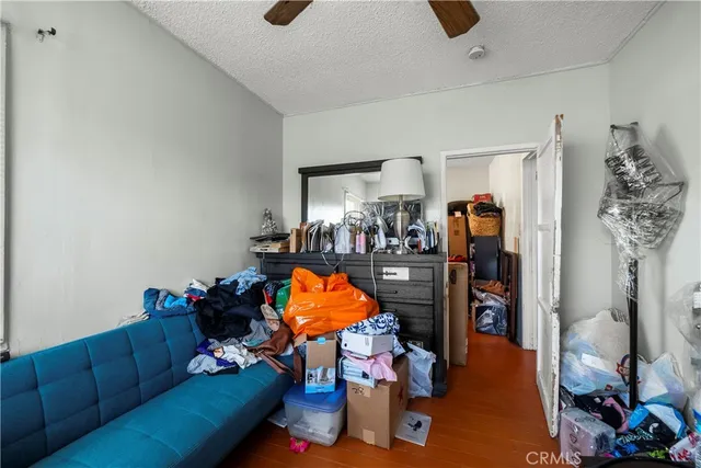 a living room with furniture a rug and a flat screen tv
