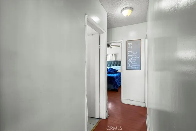 a view of a hallway and a livingroom and a hallway