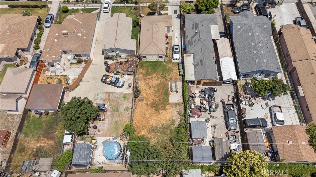 908 West 132nd Street Compton, CA 90222 - Photo 3 of 36 an aerial view of residential houses with outdoor space and parking