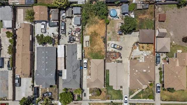 an aerial view of a residential building with outdoor space