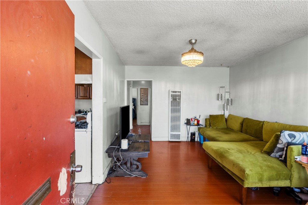 908 West 132nd Street Compton, CA 90222 - Photo 4 of 36 a living room with furniture and a chandelier