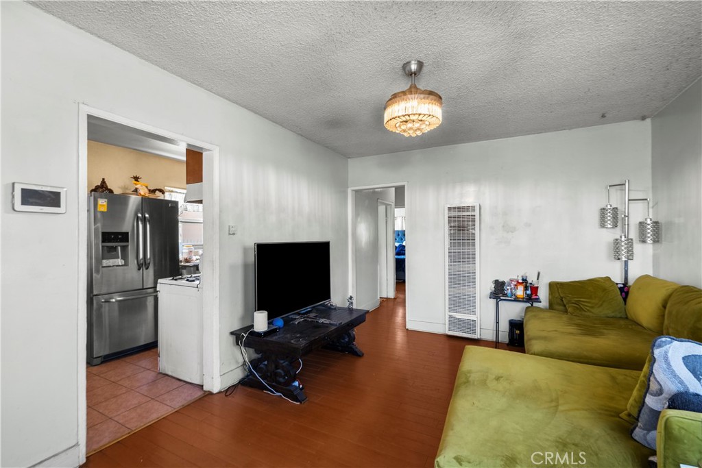 908 West 132nd Street Compton, CA 90222 - Photo 7 of 36 a living room with furniture and a flat screen tv