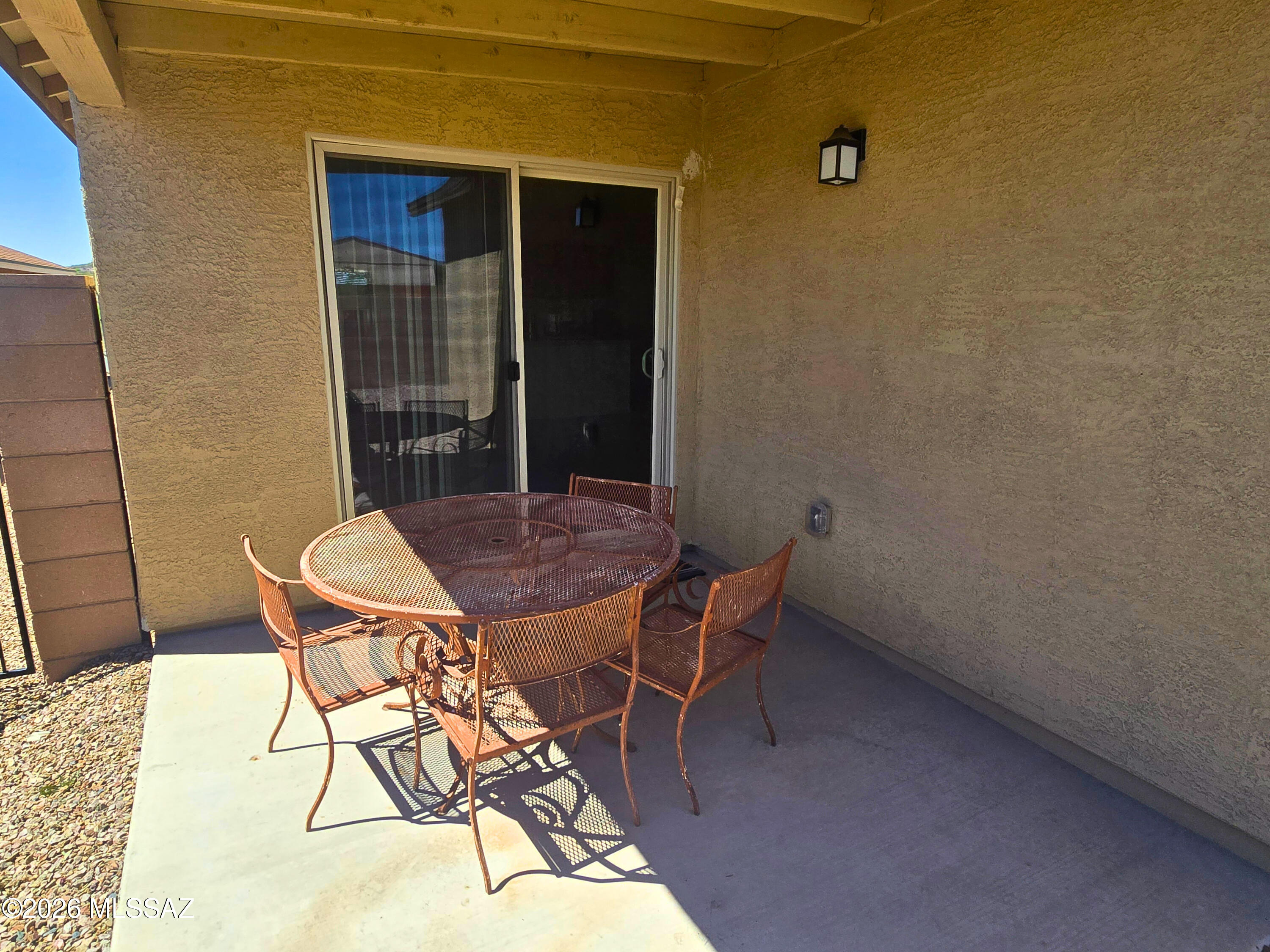 6343 South Rigby Way Tucson, AZ 85746 - Photo 22 of 29 a patio with table and chairs and potted plants