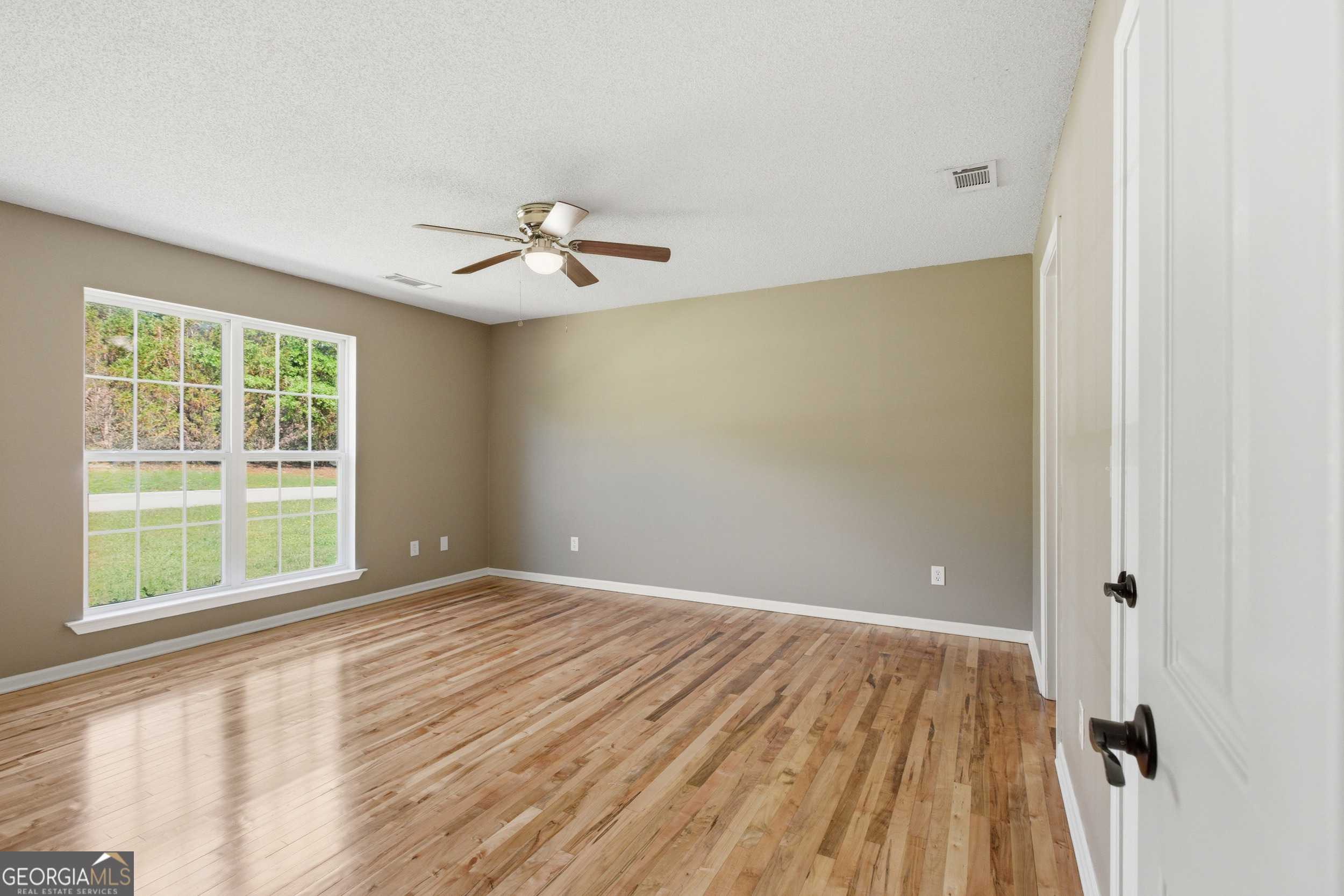 171 Winding Way Hartwell, GA 30643 - Photo 17 of 37 a view of an empty room with a window